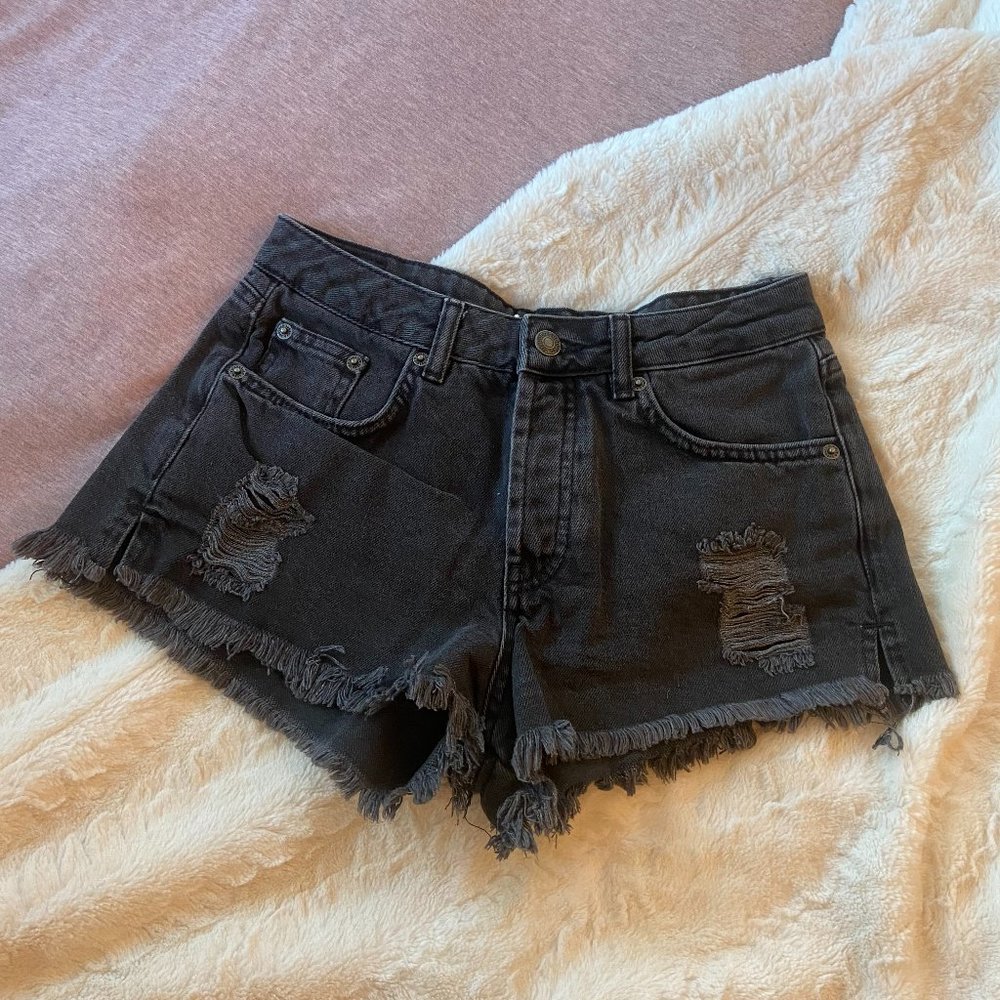 Subdued black denim cut off shorts